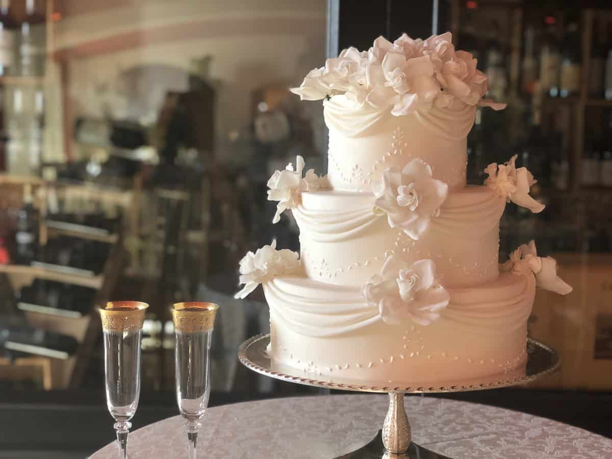Castello di Velona three tier wedding cake with drapery